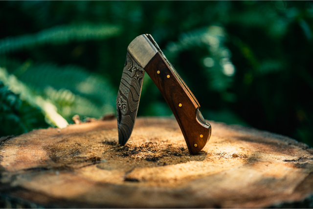 walnut damascus pocket knife