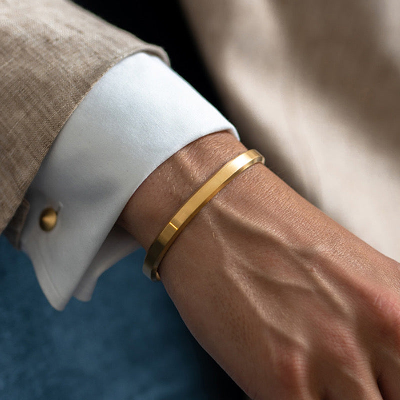 Premium Photo | Men wearing a golden bracelet on hand and rings of gold